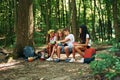 Taking a break. Kids strolling in the forest with travel equipment Royalty Free Stock Photo