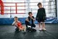 Taking a break, resting. Boys training boxing in the gym together Royalty Free Stock Photo