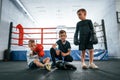 Taking a break, resting. Boys training boxing in the gym together Royalty Free Stock Photo