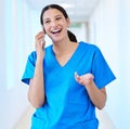 Taking a break to catch up. a young dental assistant using her smartphone to make a call.