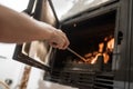 Taking care of fire in fireplace