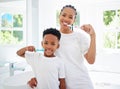 Taking care of teeth and gums is crucial for longterm health. Portrait of little boy and his mother brushing their teeth Royalty Free Stock Photo