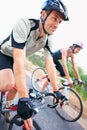 Taking a casual ride...Closeup shot of two cyclists enjoying a sunny day ride together.