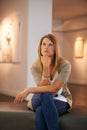 Taking in a century of art. a young woman looking at paintings in a gallery. Royalty Free Stock Photo