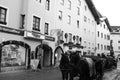 Taking a coach through the old part of tourist-city KitzbÃÂ¼hel in Austria