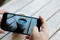 Taking coffee photo by smartphone camera Royalty Free Stock Photo