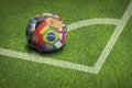 Taking corner with world flags soccer ball Royalty Free Stock Photo