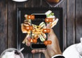 Taking food photograph by mobile smart phone, and sharing on social media, social network with notification icons Royalty Free Stock Photo