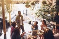 Taking his team out for a business lunch. a group of creative workers having a meeting over lunch in a cafe.