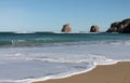 Taking holidays on sandy beach by twin rocks, hendaye, basque country, france Royalty Free Stock Photo