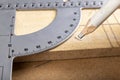 Taking measurements and drawing lines with a pencil. Minor carpentry work in a carpentry workshop Royalty Free Stock Photo