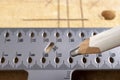 Taking measurements and drawing lines with a pencil. Minor carpentry work in a carpentry workshop Royalty Free Stock Photo