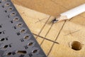Taking measurements and drawing lines with a pencil. Minor carpentry work in a carpentry workshop Royalty Free Stock Photo