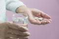 Taking medicine pills. Woman holds in hands the medicine pills a