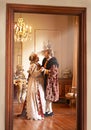 Taking a moment away from royal duties. A king and queen dancing together in their palace. Royalty Free Stock Photo