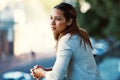 Taking a moment to contemplate her next move. an attractive young businesswoman standing on her office balcony.