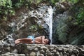 Taking nap near jungle waterfall Royalty Free Stock Photo