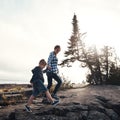 Taking a nice and easy stroll. a cheerful mother and son holding hands while walking outside in nature during the day. Royalty Free Stock Photo