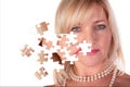 Taking off puzzle from face of middleaged woman