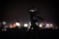 Taking photo of with camera mounted on tripod. Blurred view of city lights at night, bokeh effect Royalty Free Stock Photo