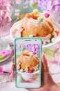 Taking photo of easter ring cake by smartphone