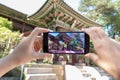 Taking Photo of Korean Architecture with Mobile Phone. Tourism and Digital Technologies