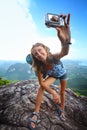 Taking photo on top of a mountain Royalty Free Stock Photo