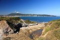 taking photos on coastal pathway with panoramic view of beautiful atlantic coast with beach, ocean and mountain jaizkibel in blue Royalty Free Stock Photo