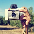 Taking a picture with an old instant camera Royalty Free Stock Photo