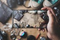 Taking Picture of Travel Concept Background. Overhead View of Traveler`s Accessories on Old Vintage Map Royalty Free Stock Photo