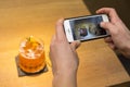 Taking a picture of two cocktails with a mobile device