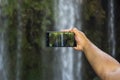 Taking picture of waterfall lansdcape with smart phone