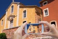 Taking pictures of color church in Roussillon