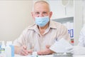 Taking pills, a glass of water in the hand of an elderly person Royalty Free Stock Photo