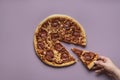 Taking pizza slice. Eating pizza pepperoni. Hot italian pizza Royalty Free Stock Photo