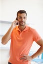 Taking a quick call. A casual young businessman taking a phone call. Royalty Free Stock Photo