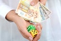 Taking a risk and winning concept with a pair of dice and money Royalty Free Stock Photo