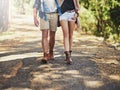 Taking the road less travelled. an affectionate young couple during a hike. Royalty Free Stock Photo