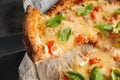 Taking slice of delicious pizza Margherita, closeup Royalty Free Stock Photo