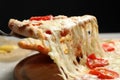 Taking slice of delicious pizza Margherita at table, closeup Royalty Free Stock Photo