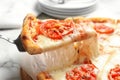 Taking slice of hot cheese pizza Margherita on table Royalty Free Stock Photo