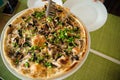 Slices of pizza. Table with pizza in a restaurant. Pizza close up on a green