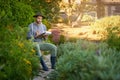 Taking stock of the crop. a young man checking the stock in his garden.