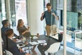 Taking stock and setting new targets. a corporate businessperson giving a presentation in the boardroom. Royalty Free Stock Photo