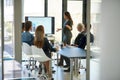 Taking stock and setting new targets. a corporate businessperson giving a presentation in the boardroom.