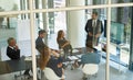 Taking stock and setting new targets. a corporate businessperson giving a presentation in the boardroom.