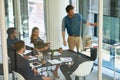 Taking stock and setting new targets. a corporate businessperson giving a presentation in the boardroom. Royalty Free Stock Photo