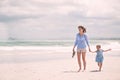 Taking a stroll on the beach. young mother and her daughter going for a walk along the beach. Royalty Free Stock Photo