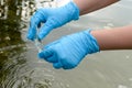 Taking a water test for analysis from a reservoir. Royalty Free Stock Photo