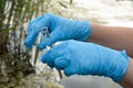 Taking a water test for analysis from a reservoir. Royalty Free Stock Photo